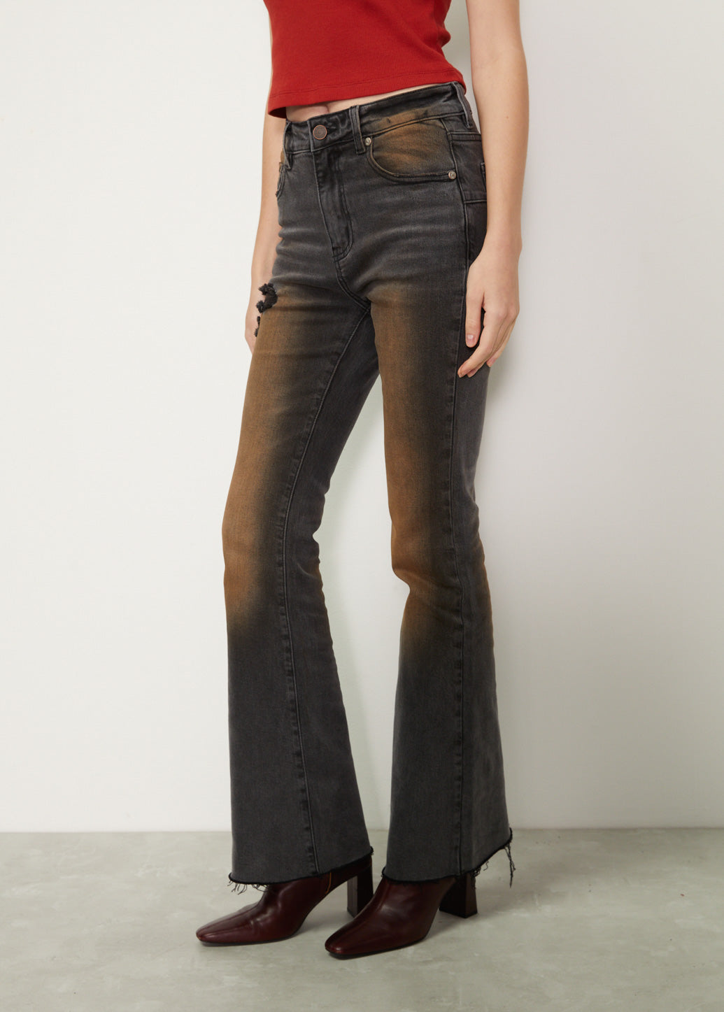 DISTRESSED BLACK FLARE JEANS